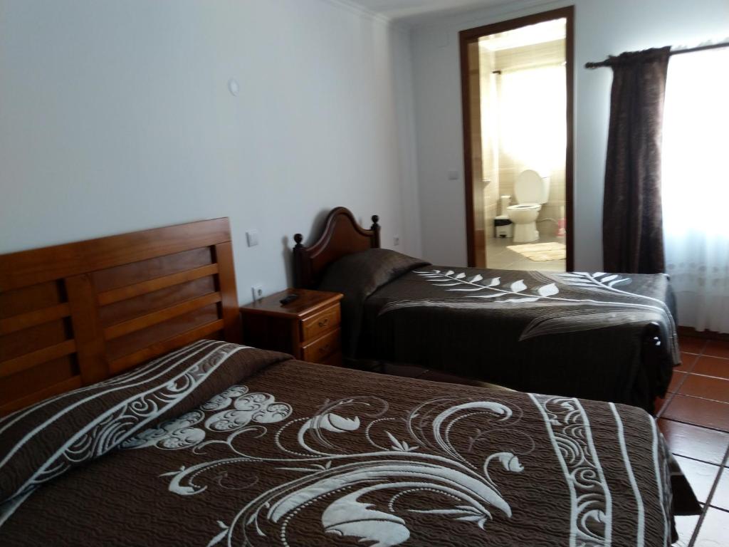 Postel nebo postele na pokoji v ubytování AzoresDream