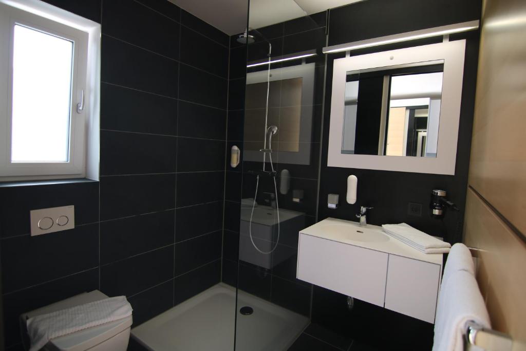 Koupelna v ubytování AI Hotel by WMM Hotels