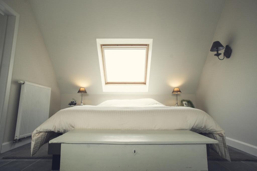 Postel nebo postele na pokoji v ubytování B&B In de velden