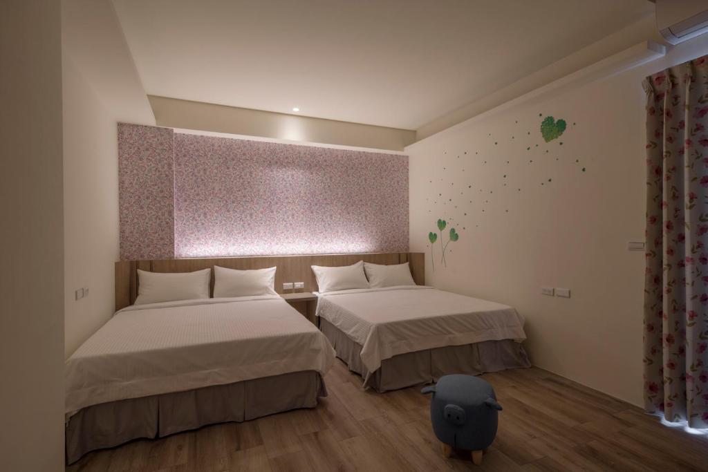 Postel nebo postele na pokoji v ubytování Finding Sea B&B Hall 2