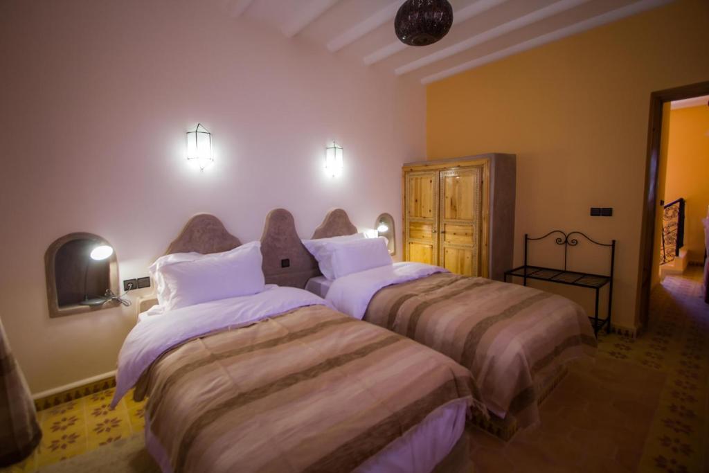 Postel nebo postele na pokoji v ubytování Hassilabiad Appart Hotel