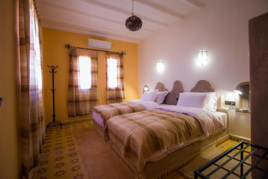 Postel nebo postele na pokoji v ubytování Hassilabiad Appart Hotel