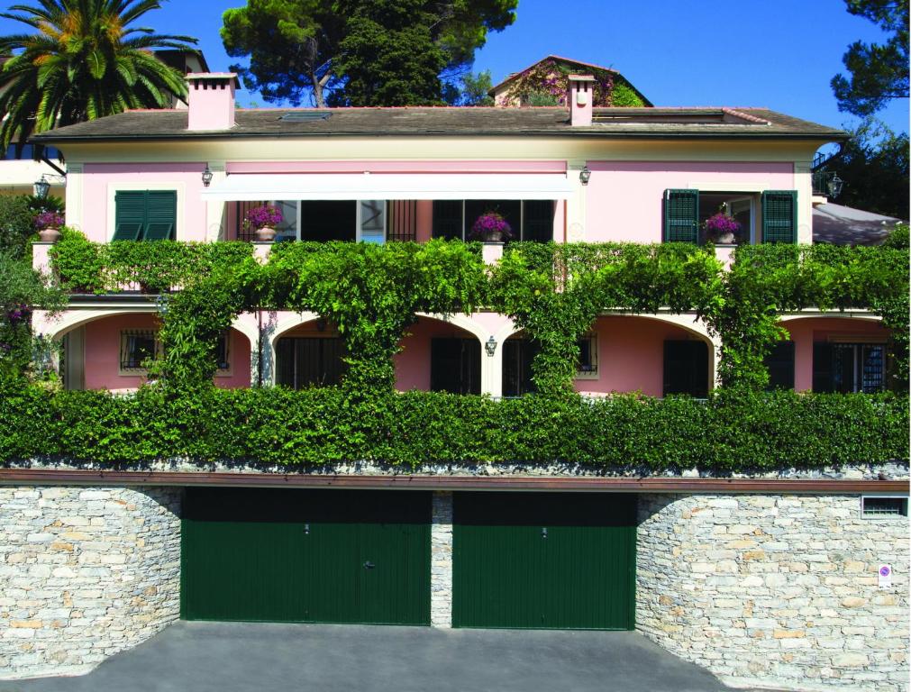 a house with a large window and a large building behind it at Villa Mares in Rapallo