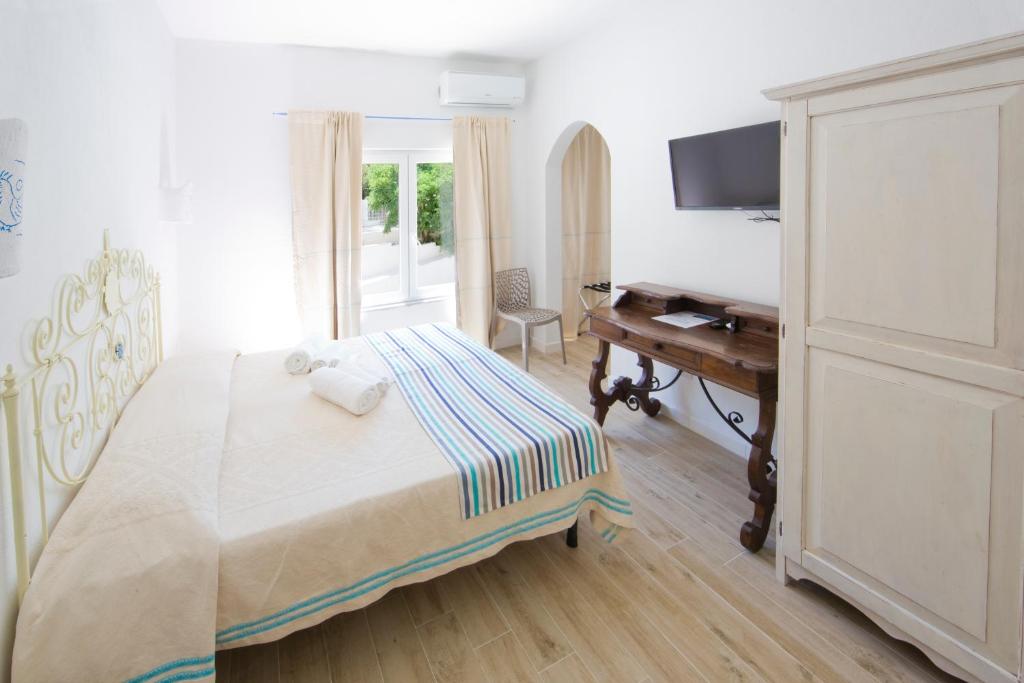 Postel nebo postele na pokoji v ubytování Grand Hotel Palau