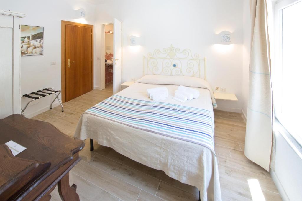 Postel nebo postele na pokoji v ubytování Grand Hotel Palau