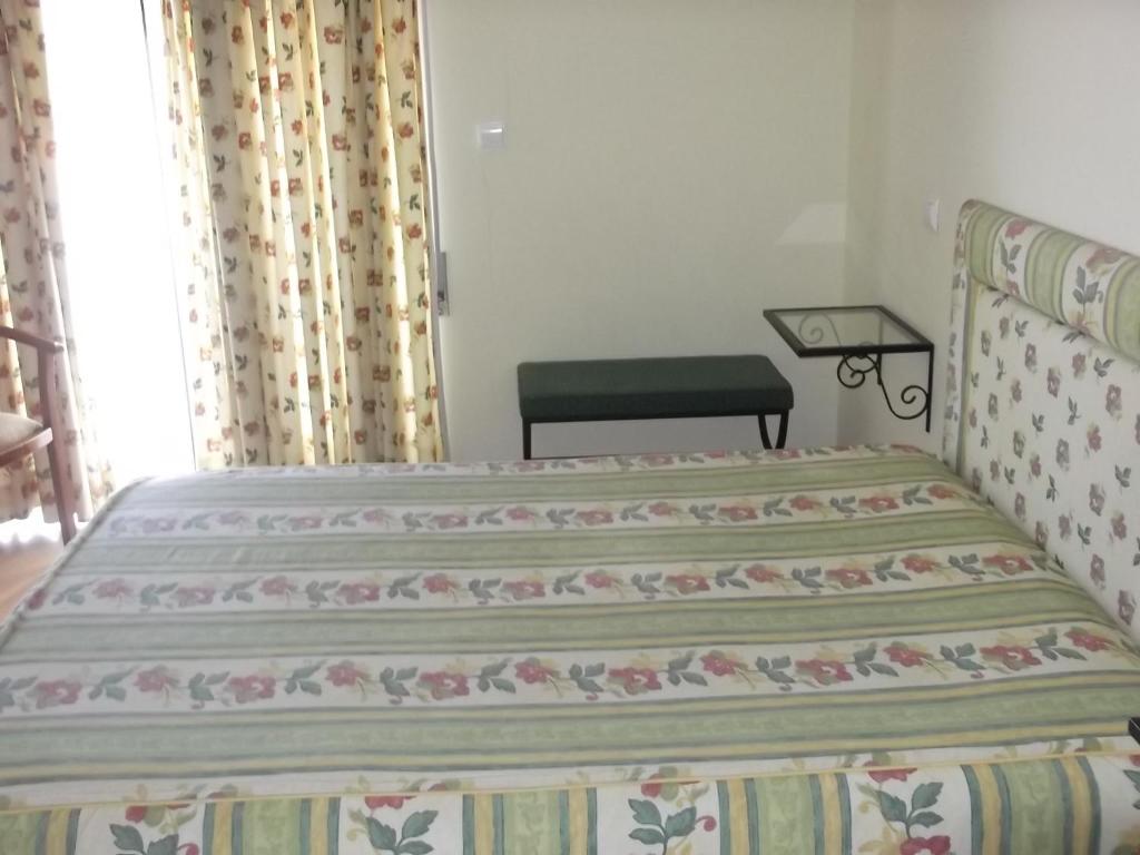 Postel nebo postele na pokoji v ubytování Hotel Minho Belo