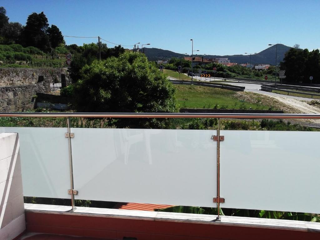 a balcony with a view of a road at Hotel Minho Belo in Vila Nova de Cerveira