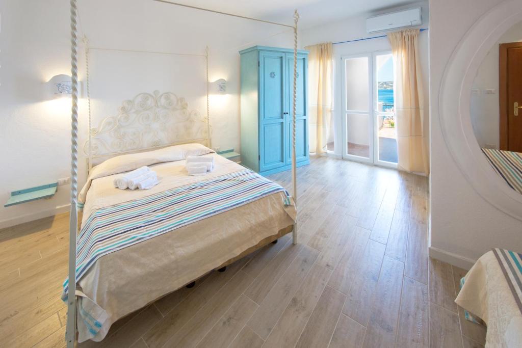 Postel nebo postele na pokoji v ubytování Grand Hotel Palau