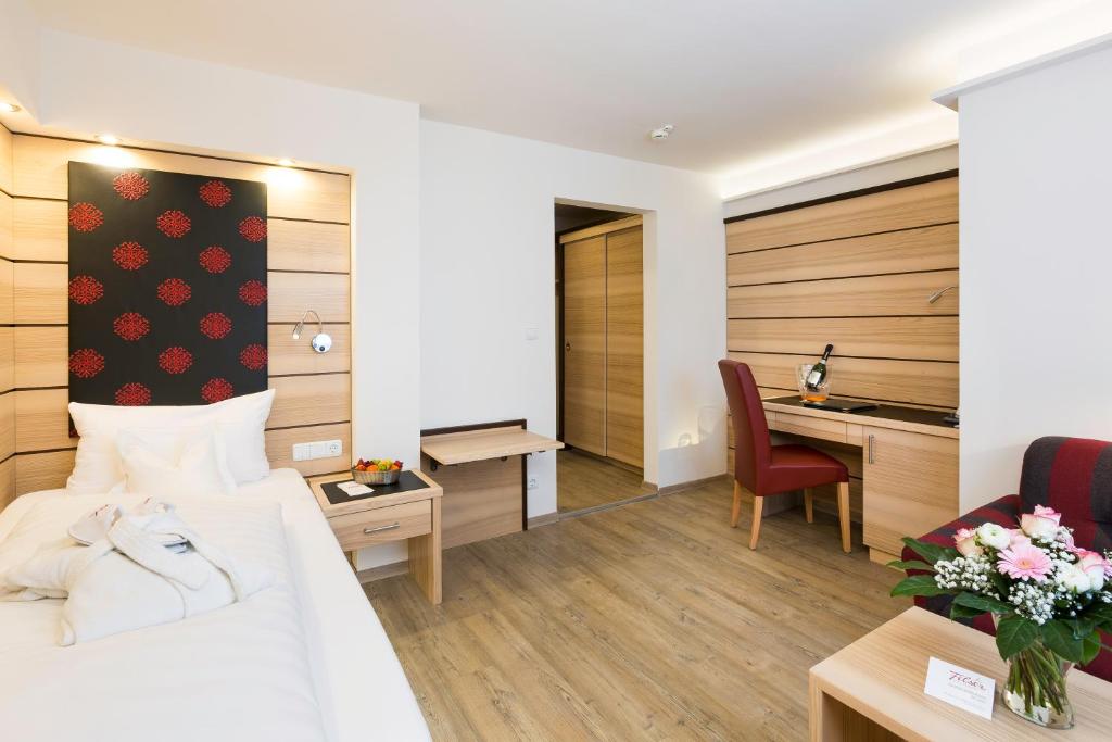 Postel nebo postele na pokoji v ubytování Hotel Filser