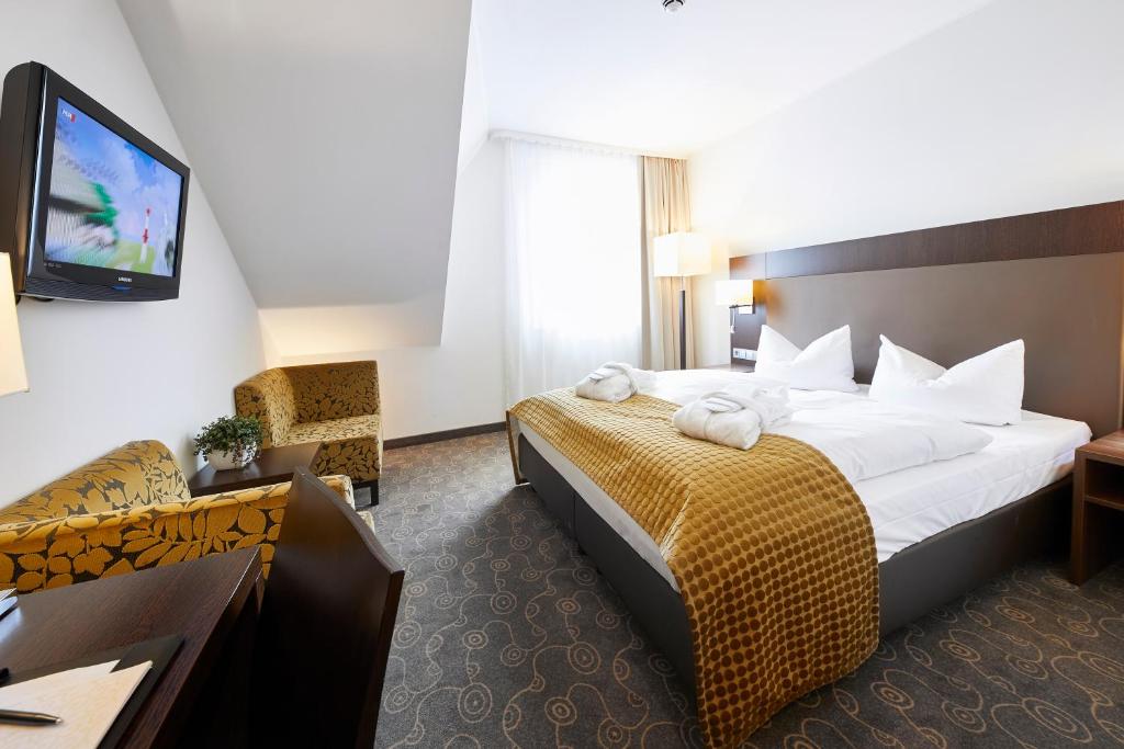 Postel nebo postele na pokoji v ubytování AVITAL Resort