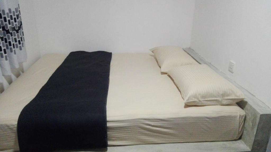 Postel nebo postele na pokoji v ubytování Mango Roots
