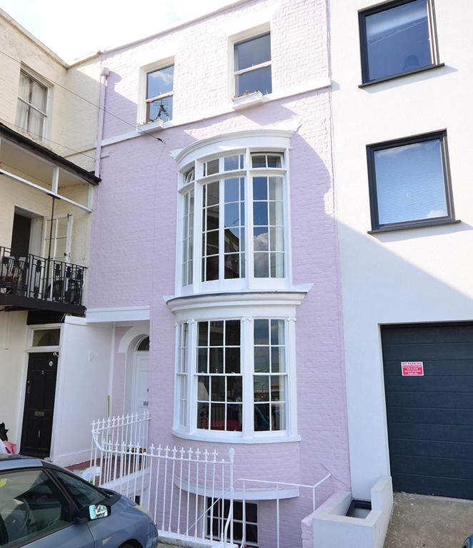 a purple house with a car parked in front of it at Casa Mar Bella, a Large House with Sweeping Sea and Beach Views in Ramsgate