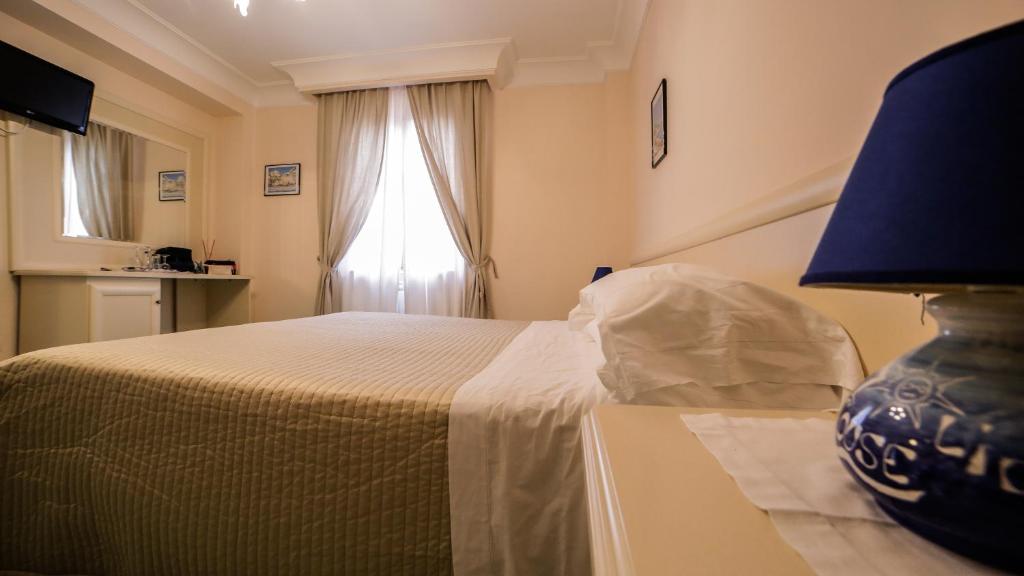 Postel nebo postele na pokoji v ubytování Casa Vacanze Vittoria