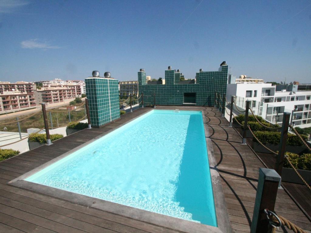 a swimming pool on the roof of a building at B03 - Luxury 2 Bed Lagos Marina in Lagos