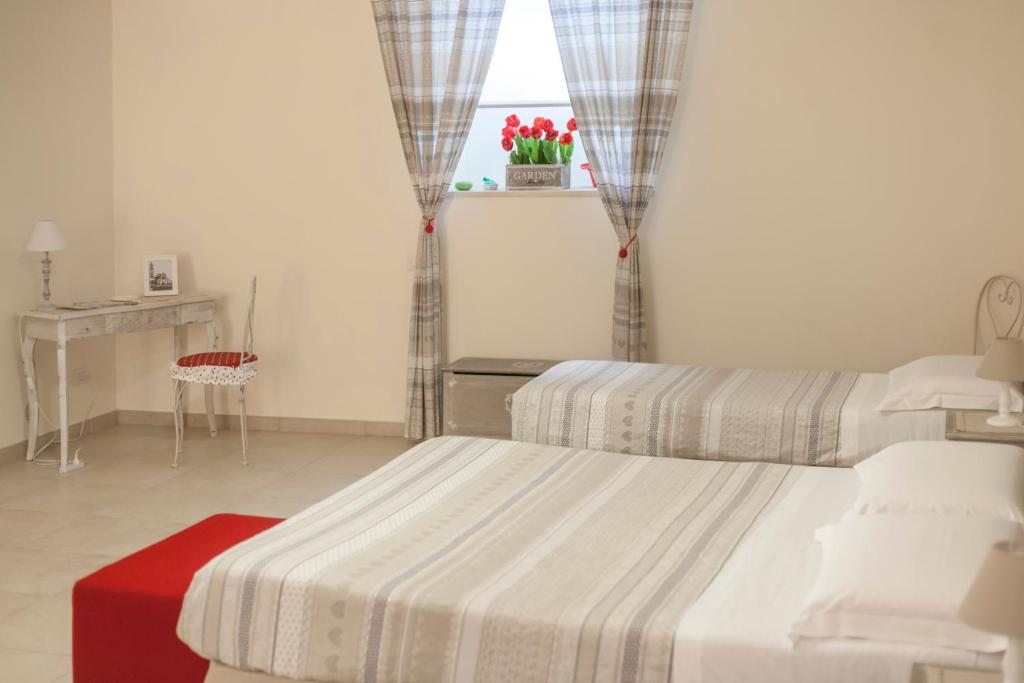 Postel nebo postele na pokoji v ubytování Alma Camere Affittacamere
