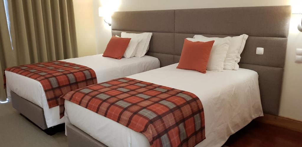 Postel nebo postele na pokoji v ubytování Hotel O Colmo