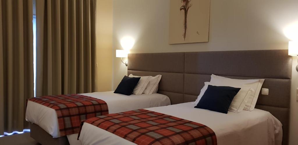 Postel nebo postele na pokoji v ubytování Hotel O Colmo