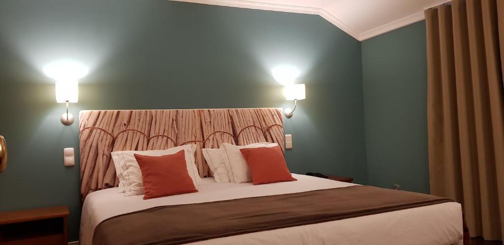 Postel nebo postele na pokoji v ubytování Hotel O Colmo
