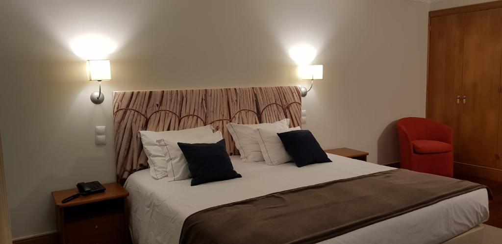 Postel nebo postele na pokoji v ubytování Hotel O Colmo