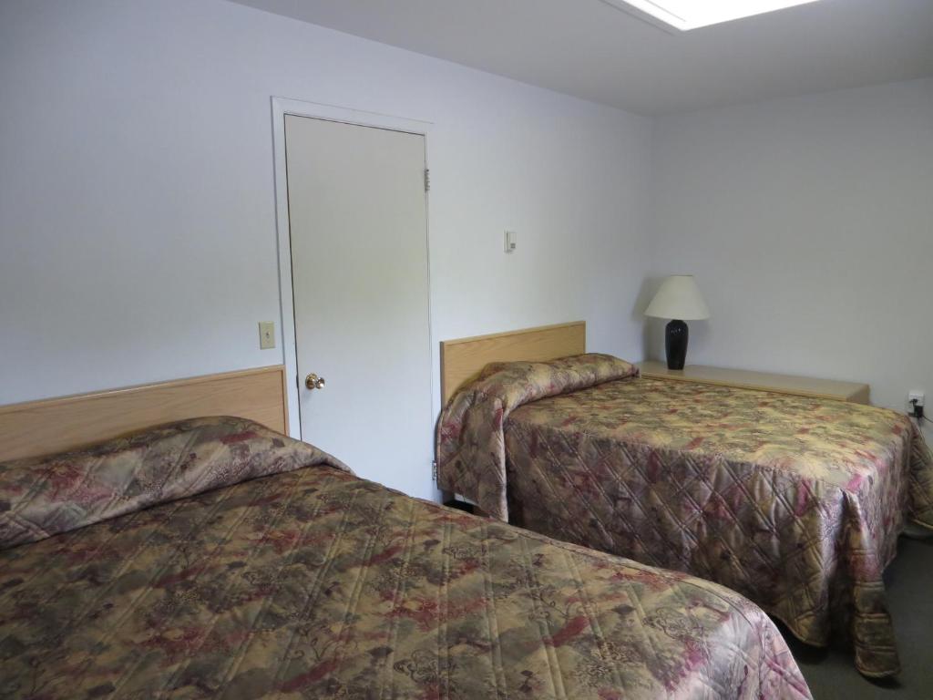 Postel nebo postele na pokoji v ubytování Lazy J Motel