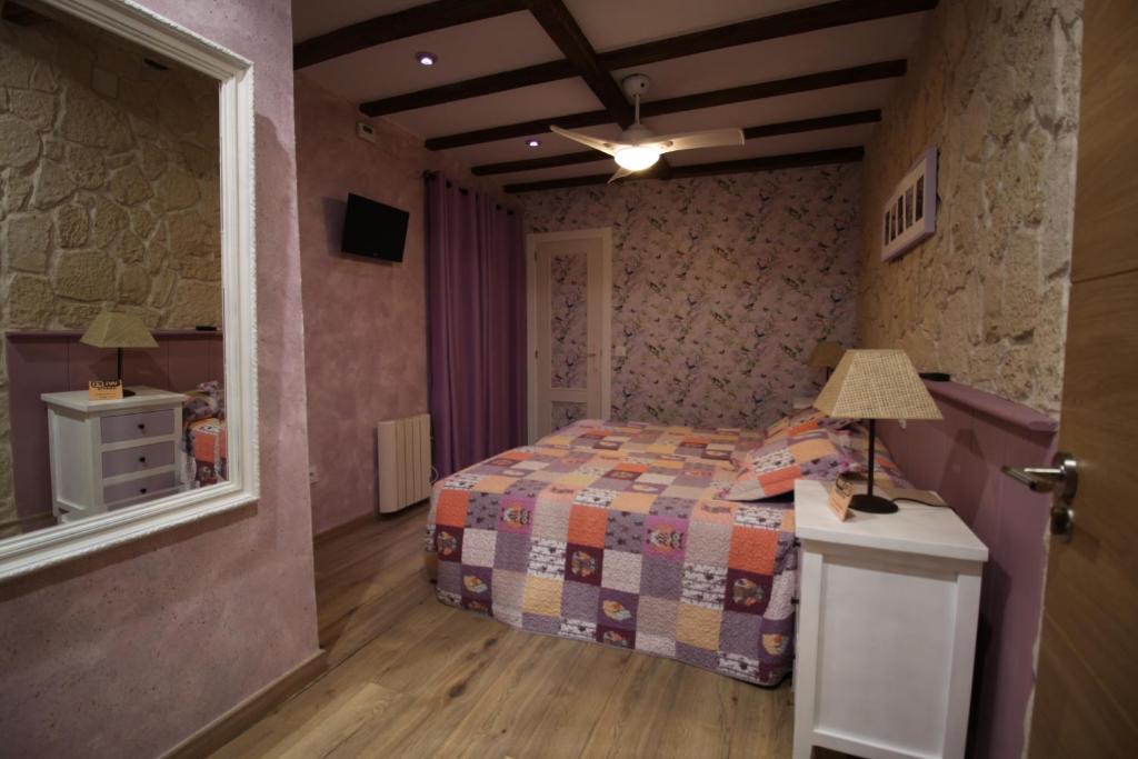 Postel nebo postele na pokoji v ubytování Posada de Peregrinos