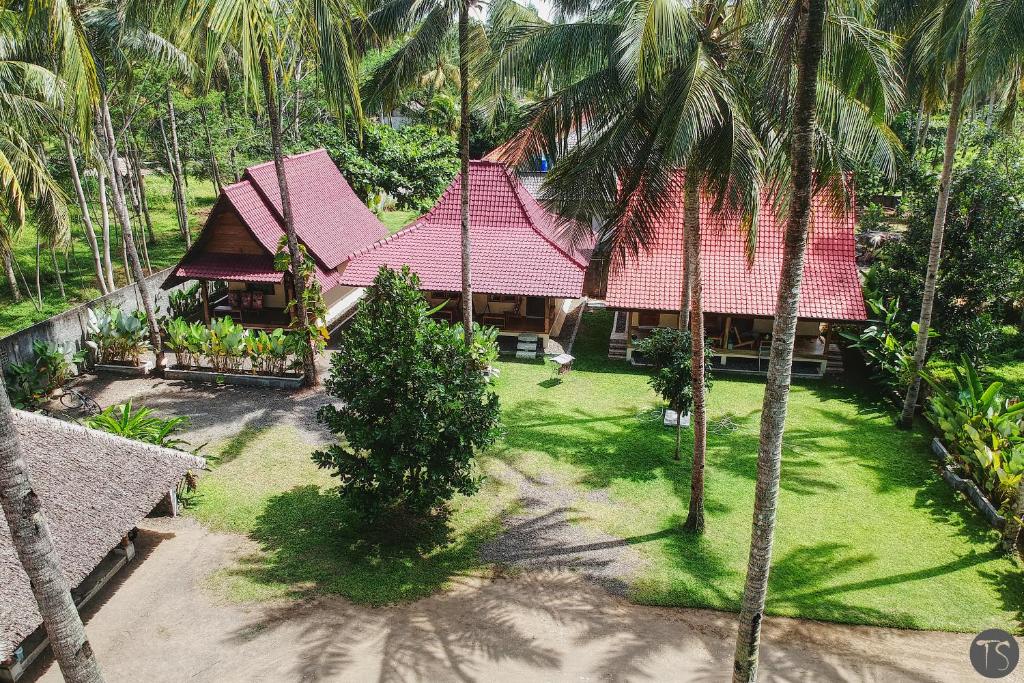 an aerial view of a house with palm trees at Sadati Home Stay in Batukaras