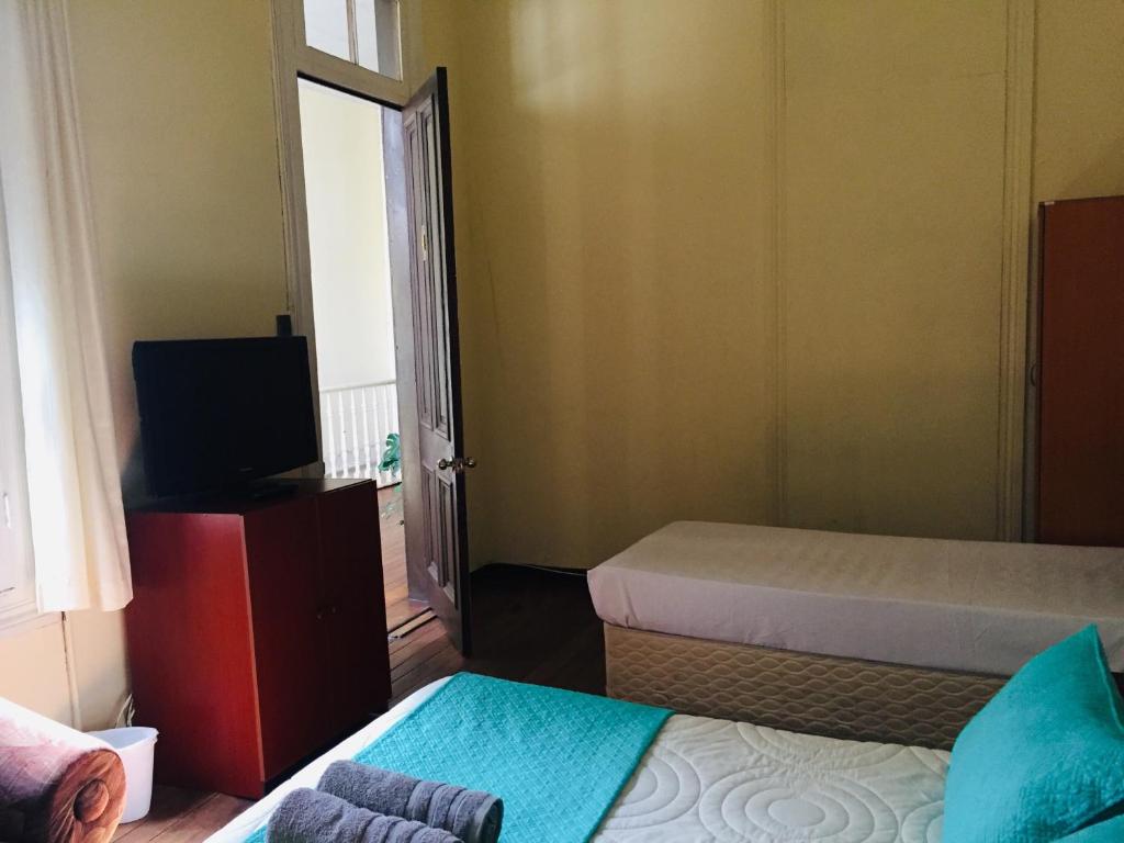 Postel nebo postele na pokoji v ubytování Hostal Rama & CaStle