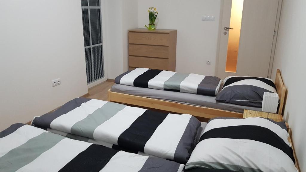 Postel nebo postele na pokoji v ubytování Apartmán Alfa 11