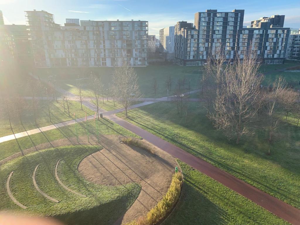 an aerial view of a road in a park with buildings at Cute Pug Guest Room in Copenhagen