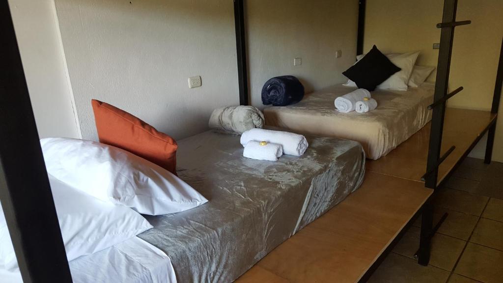 Postel nebo postele na pokoji v ubytování OutBox Inn