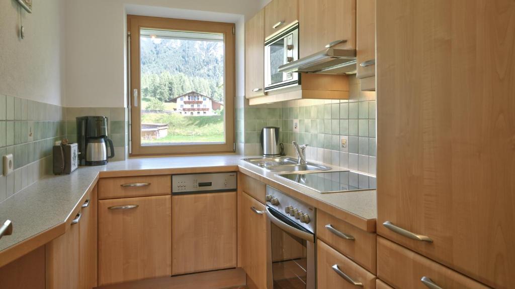 Kuchyňa alebo kuchynka v ubytovaní Komfort-Apartments Zufriedenheit