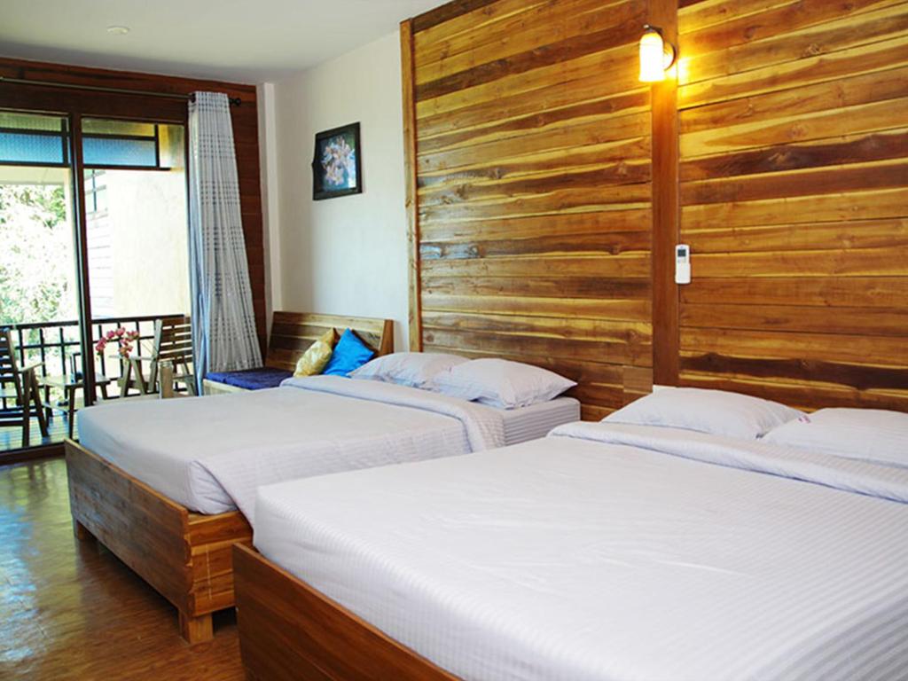 Postel nebo postele na pokoji v ubytování The Cinnamon & SaphanSufan Resort Kohmak