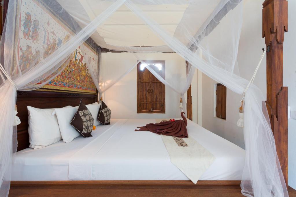 Postel nebo postele na pokoji v ubytování Bali Moon Guest House
