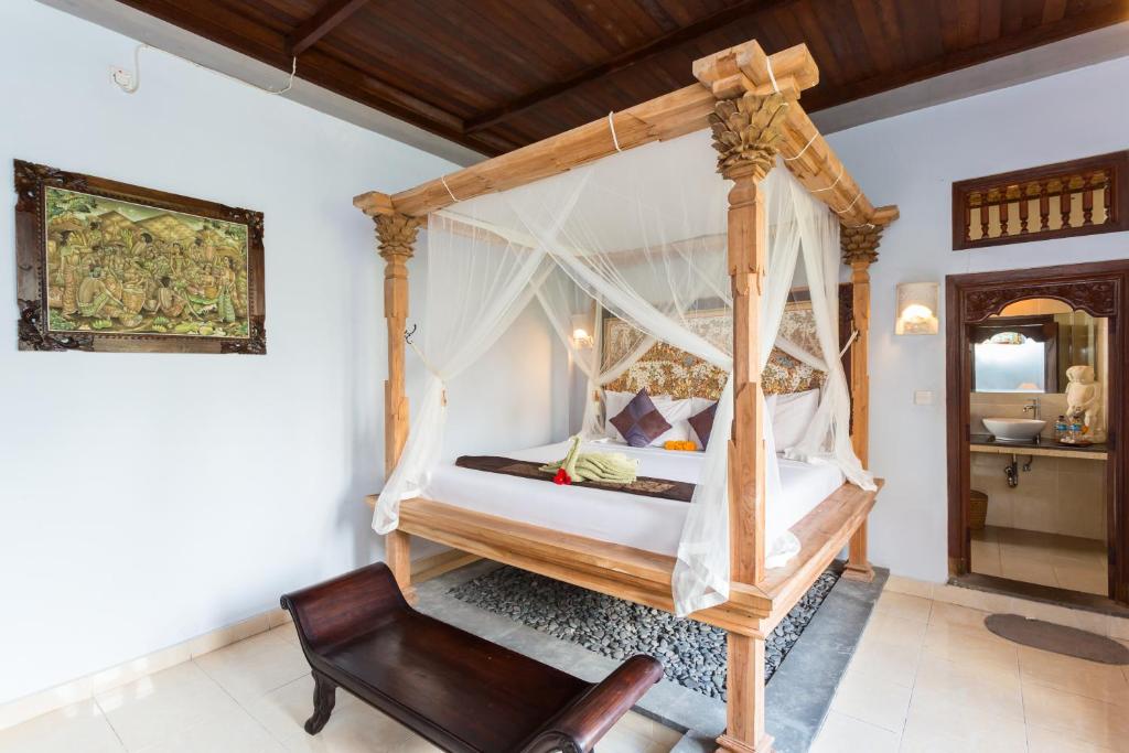 Postel nebo postele na pokoji v ubytování Bali Moon Guest House