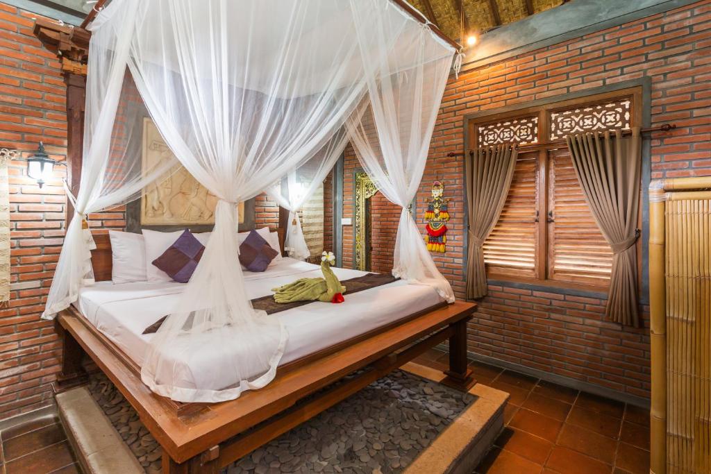 Postel nebo postele na pokoji v ubytování Bali Moon Guest House
