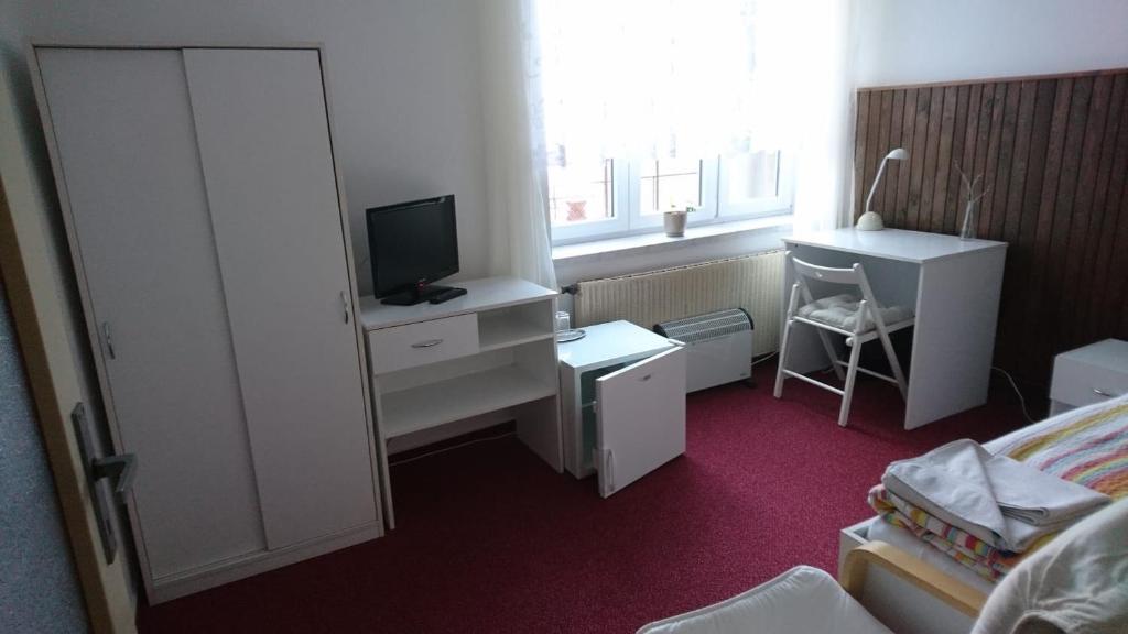 Postel nebo postele na pokoji v ubytování Hotel Šrejber
