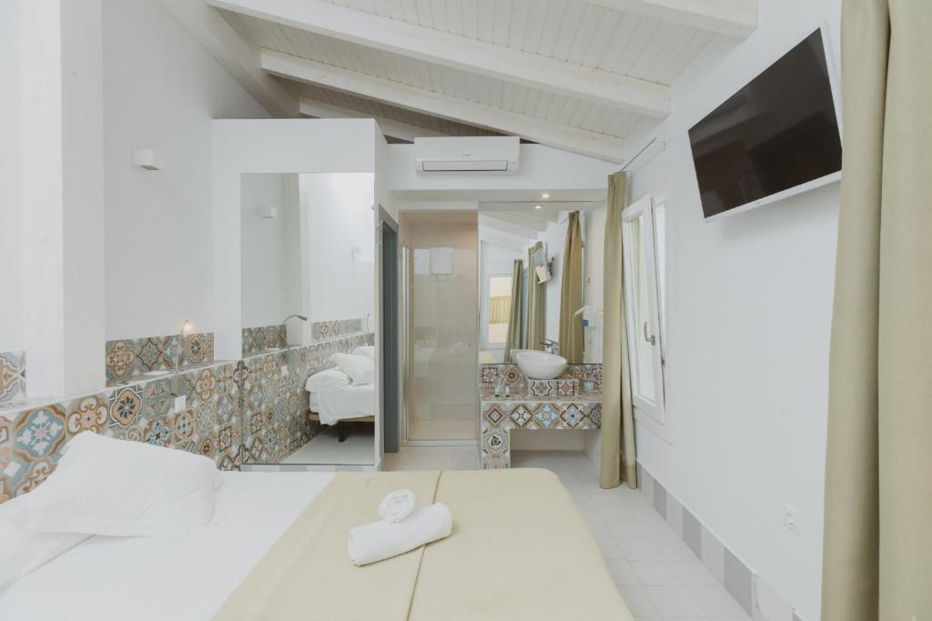 Postel nebo postele na pokoji v ubytování Hostal Gravina