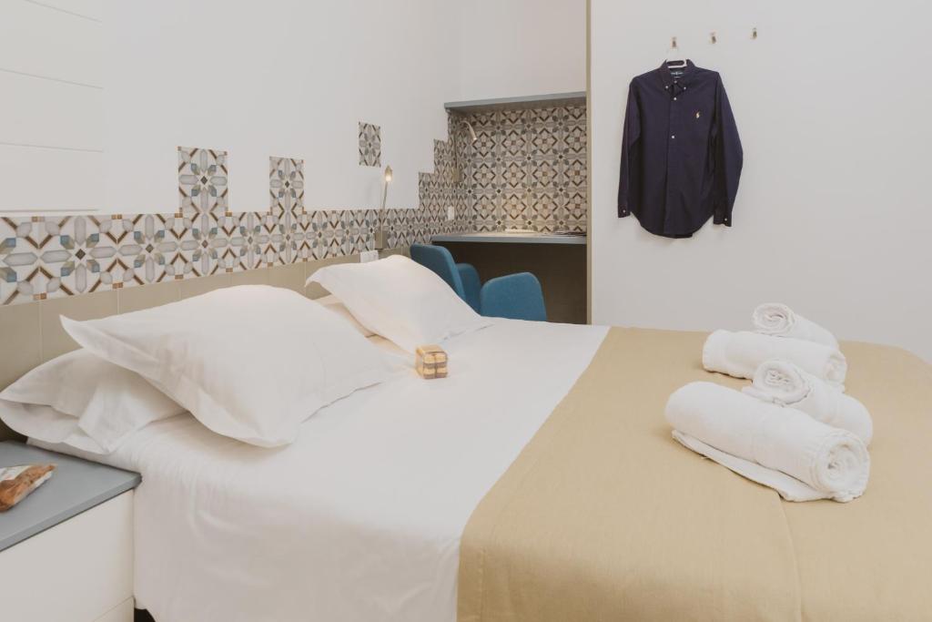 Postel nebo postele na pokoji v ubytování Hostal Gravina