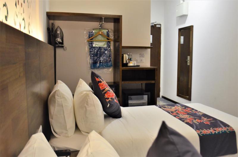 Postel nebo postele na pokoji v ubytování Serapi Hotel