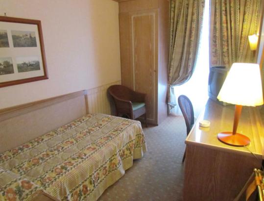 Postel nebo postele na pokoji v ubytování Grand Hotel Delle Terme Re Ferdinando