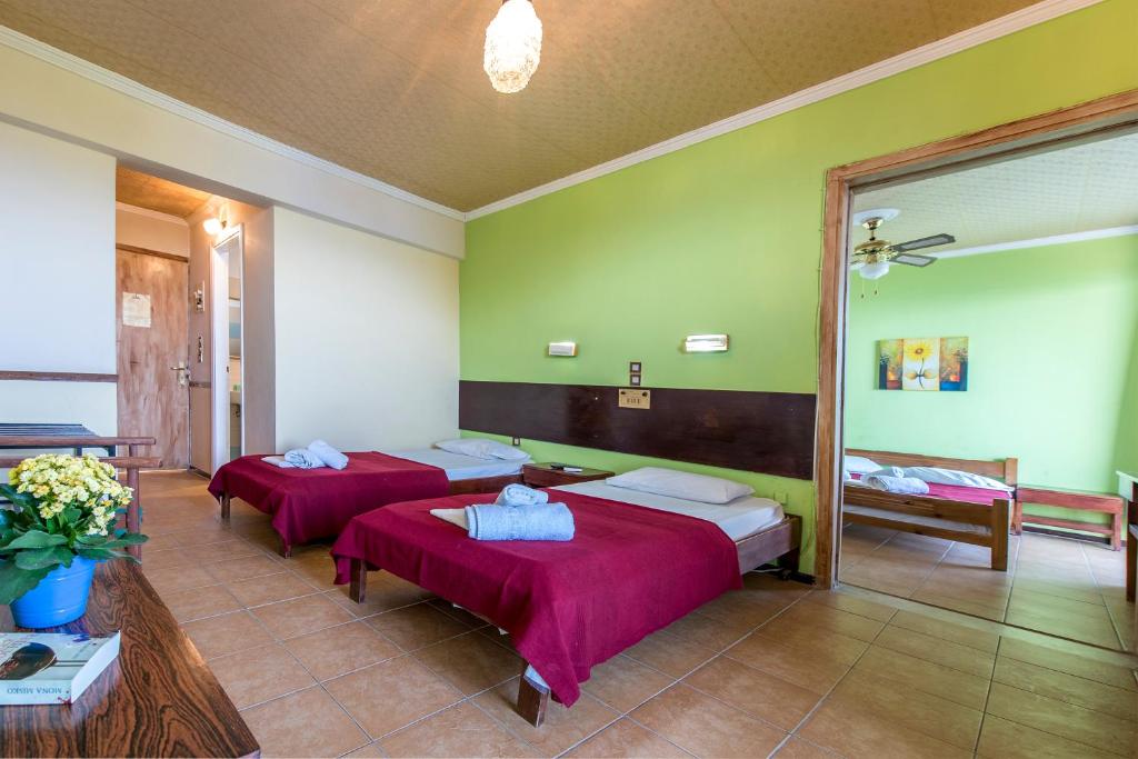 Postel nebo postele na pokoji v ubytování Sun Hotel