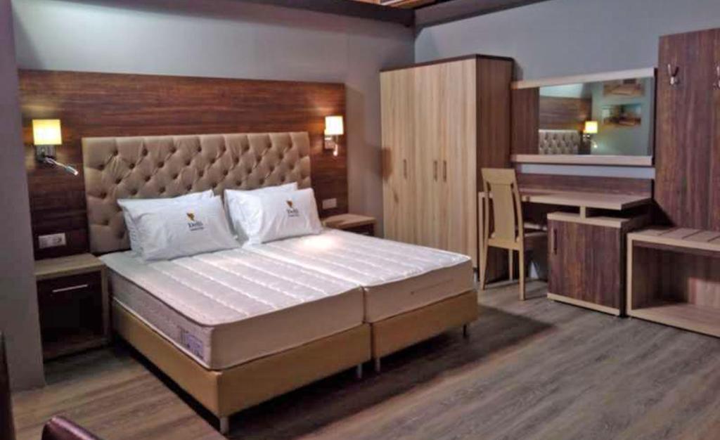 Postel nebo postele na pokoji v ubytování Castello Bianco Aparthotel