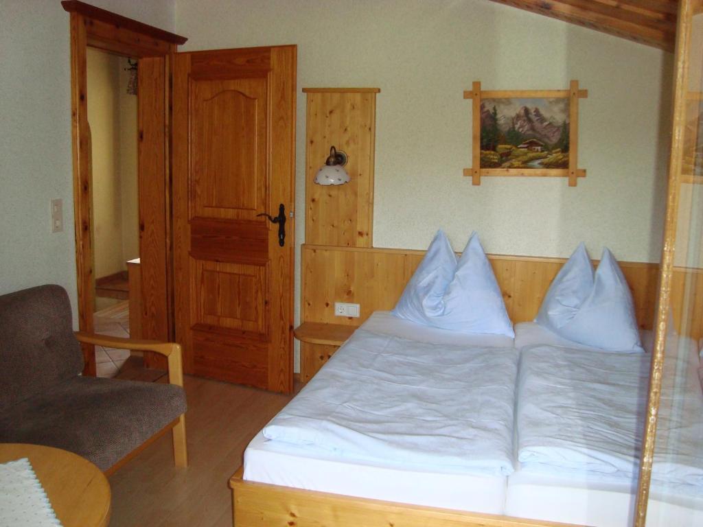 Postel nebo postele na pokoji v ubytování Haus Harmonika