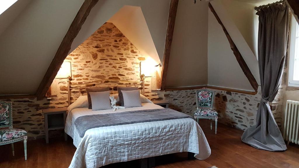 Postel nebo postele na pokoji v ubytování Le Manoir de la Bigotière