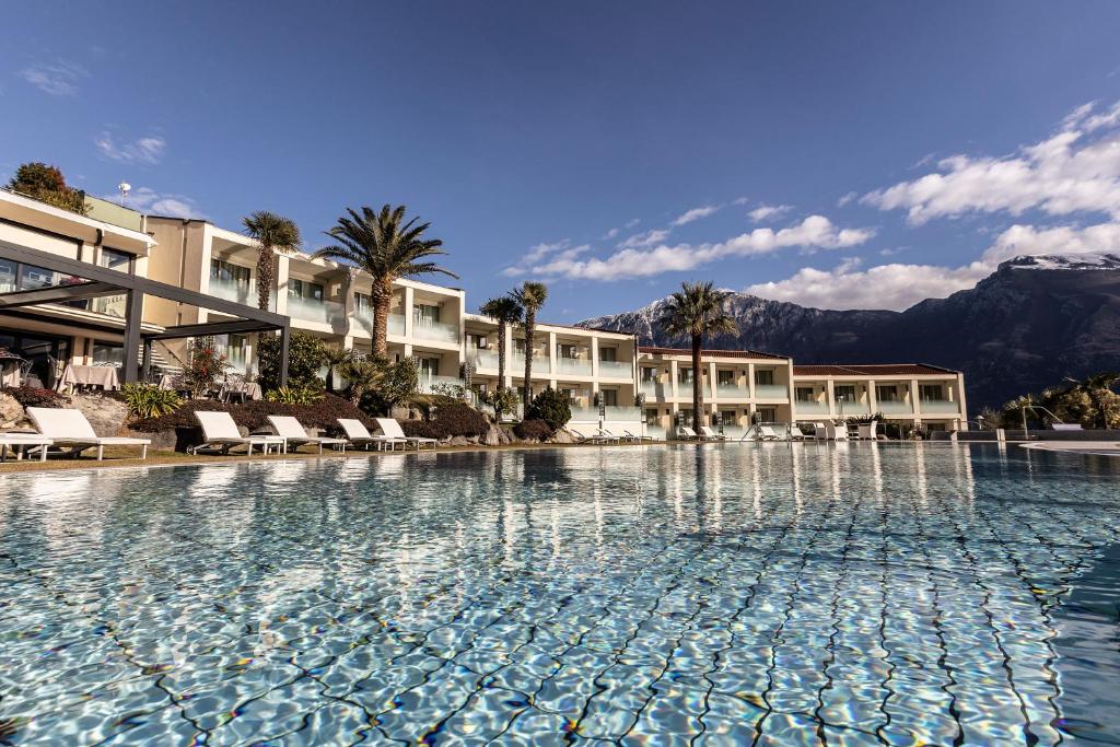 a large swimming pool in front of a hotel at Park Hotel Imperial in Limone sul Garda