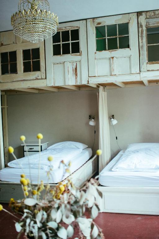 Postel nebo postele na pokoji v ubytování Hostel & Garten Eden