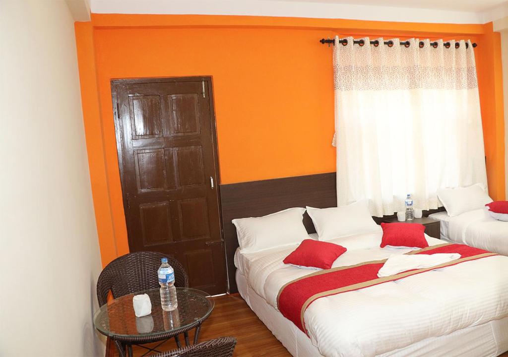 Postel nebo postele na pokoji v ubytování Rambler Hostel Pvt Ltd