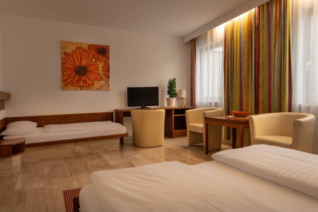 Postel nebo postele na pokoji v ubytování Hotel Anker