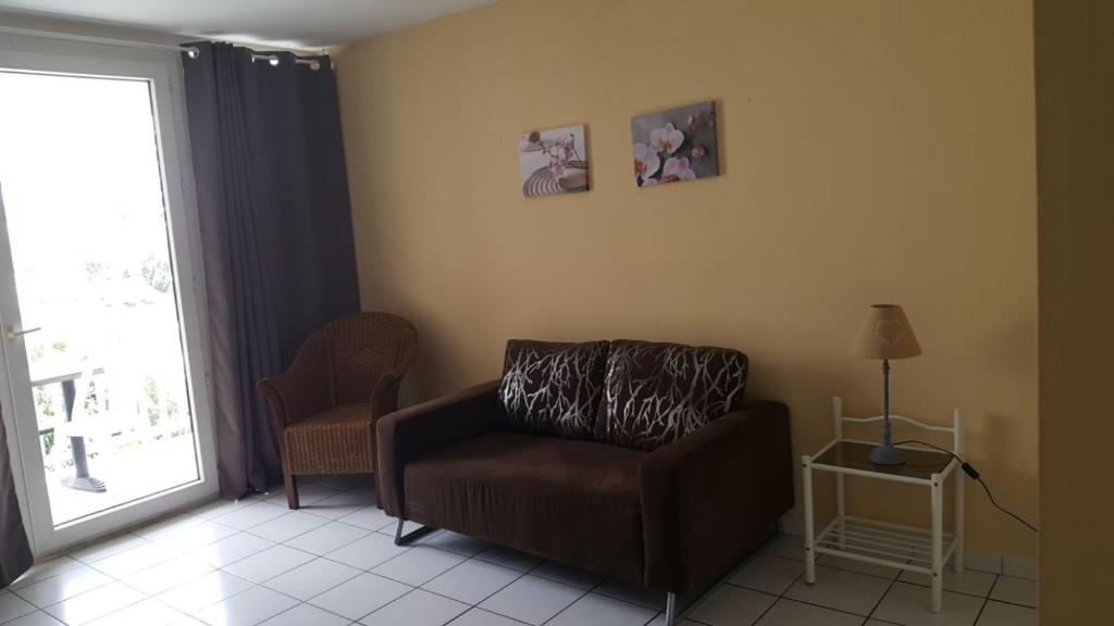 Posezení v ubytování Hotel-appart Les Manguiers