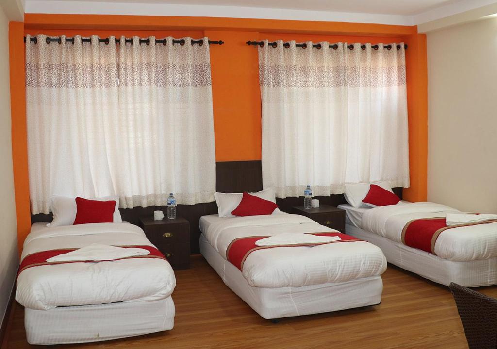 Postel nebo postele na pokoji v ubytování Rambler Hostel Pvt Ltd